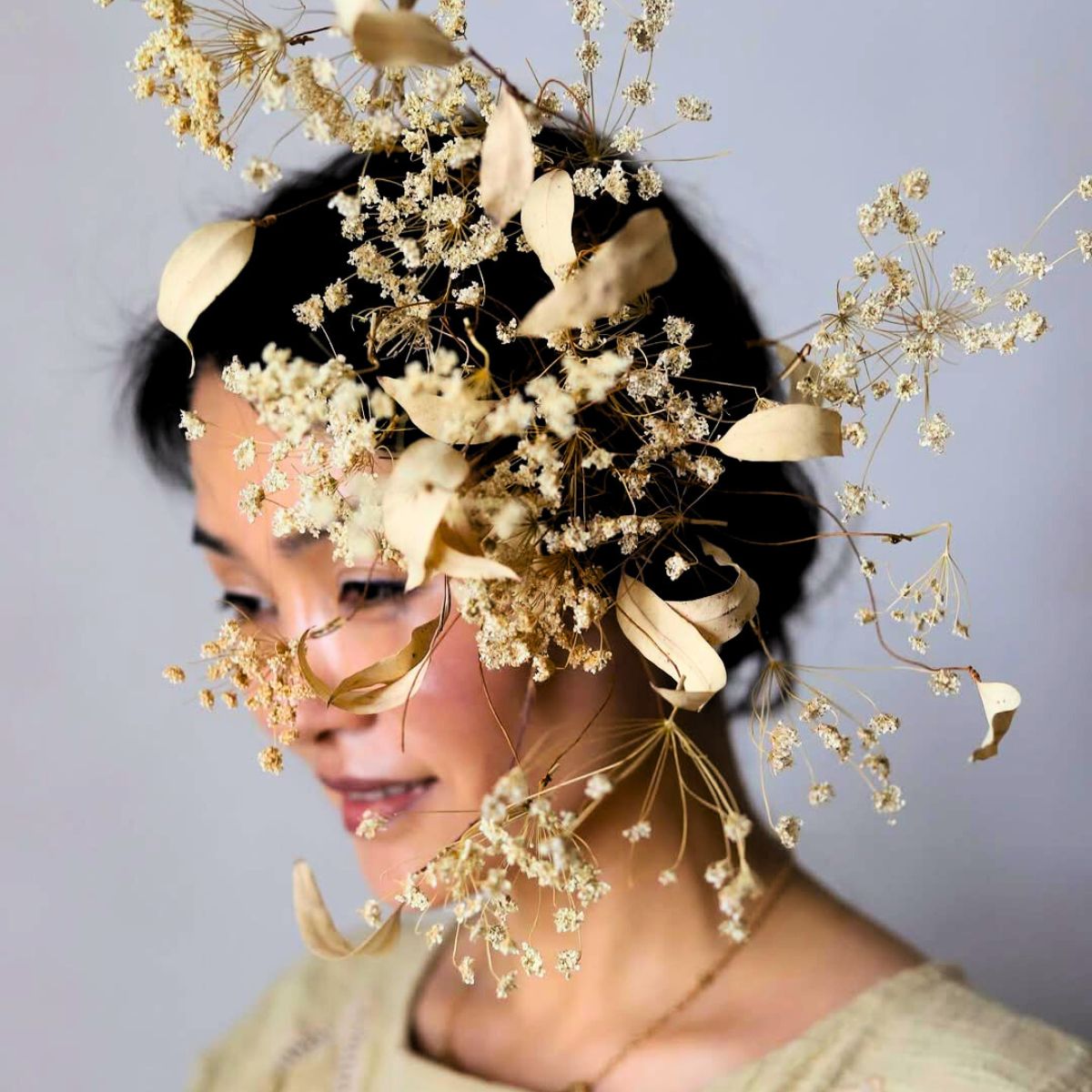 Frida Kim photographed with neutral leaves