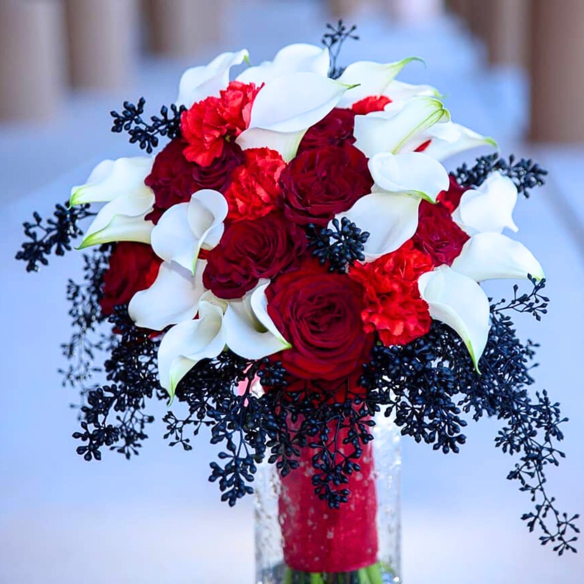 Winter themed bouquet with white callas