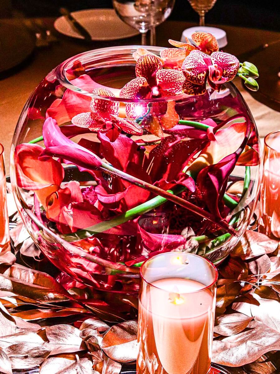 Creative idea using dark pink callas in a bowl of water