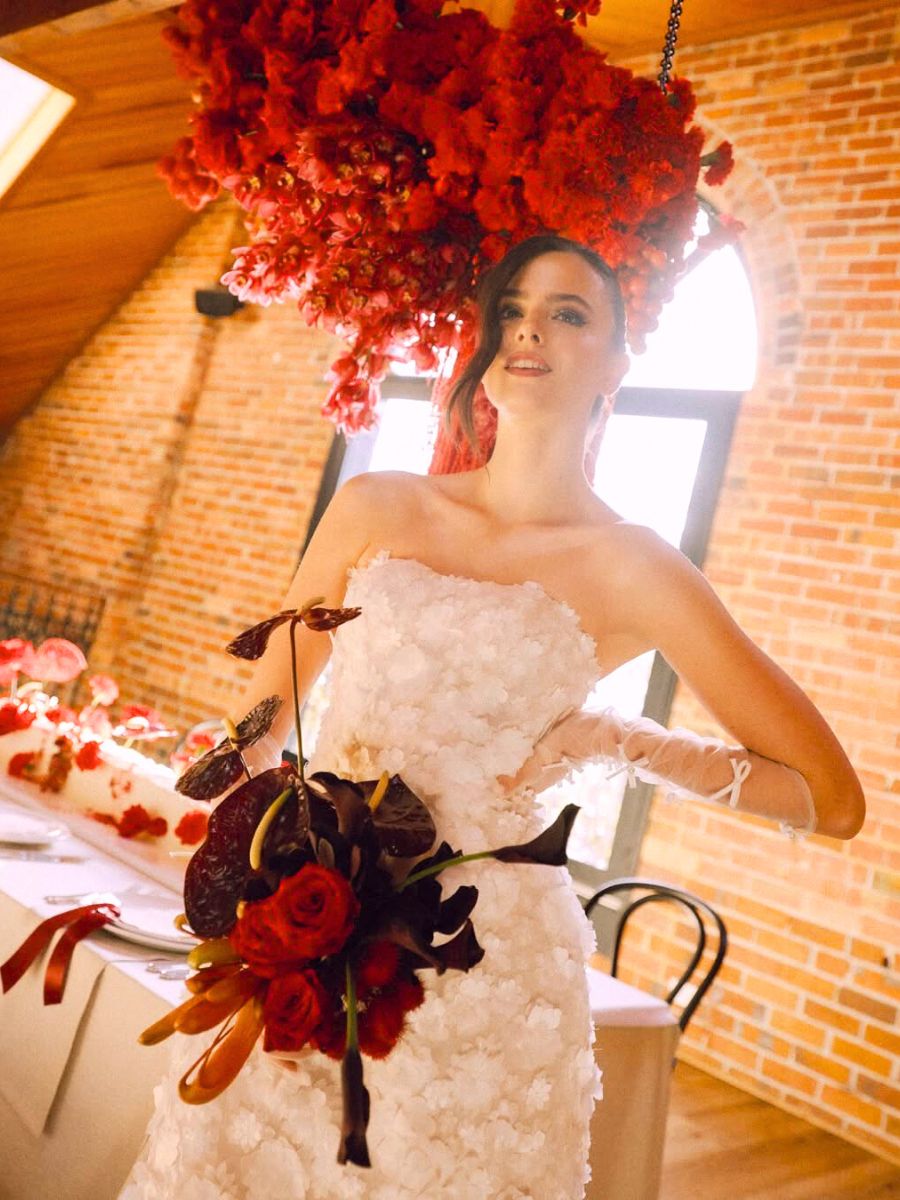 Red florals for a wedding by Shae