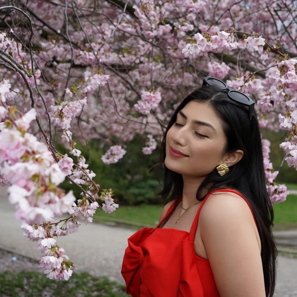 Lady enjoying with cherry flower