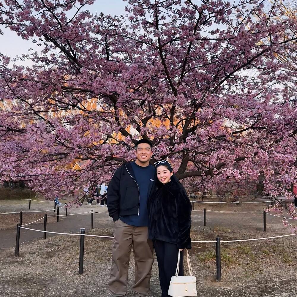 Couple enjoying cherry blossom