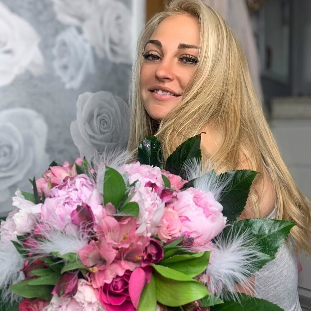 Lady with interior flower arrangement 