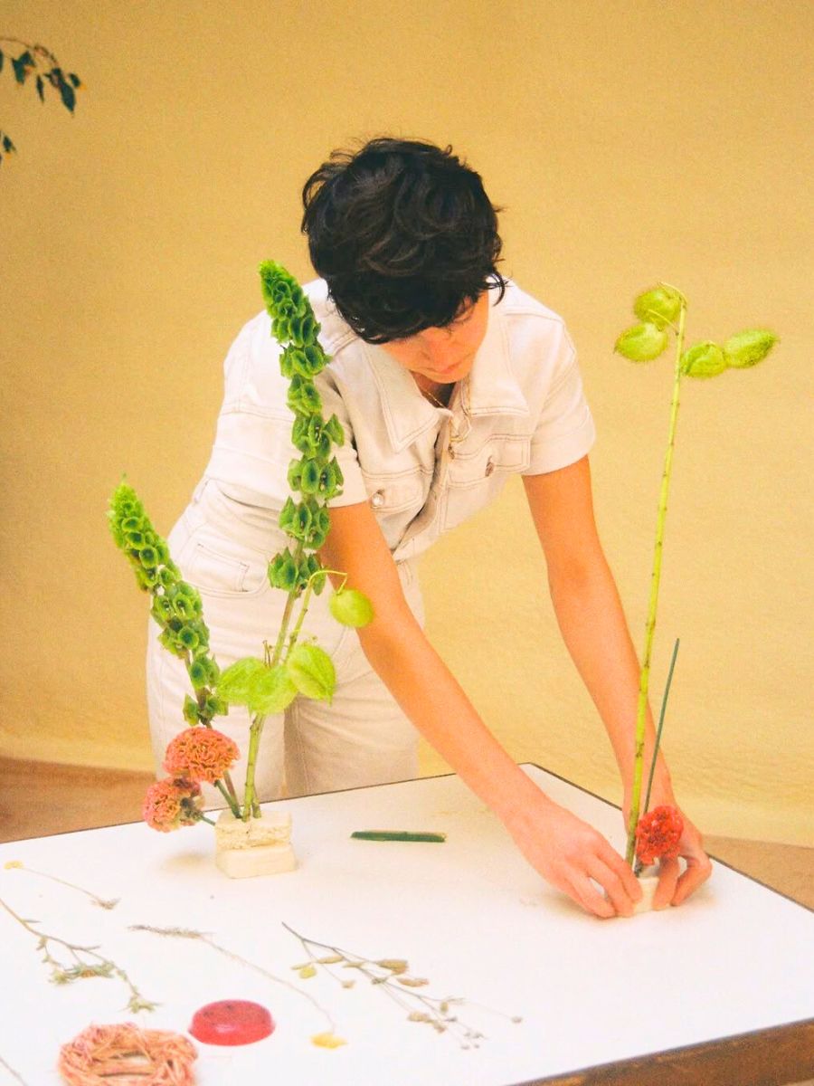 Maria Eugenia working on floral art design