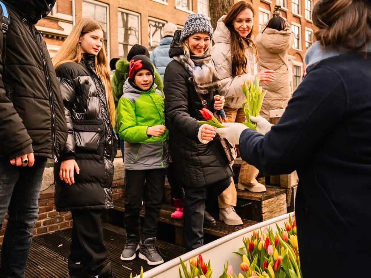 Handing out tulips to people in Amsterdam