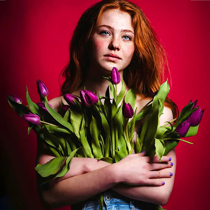 Red hair model with purple tulips