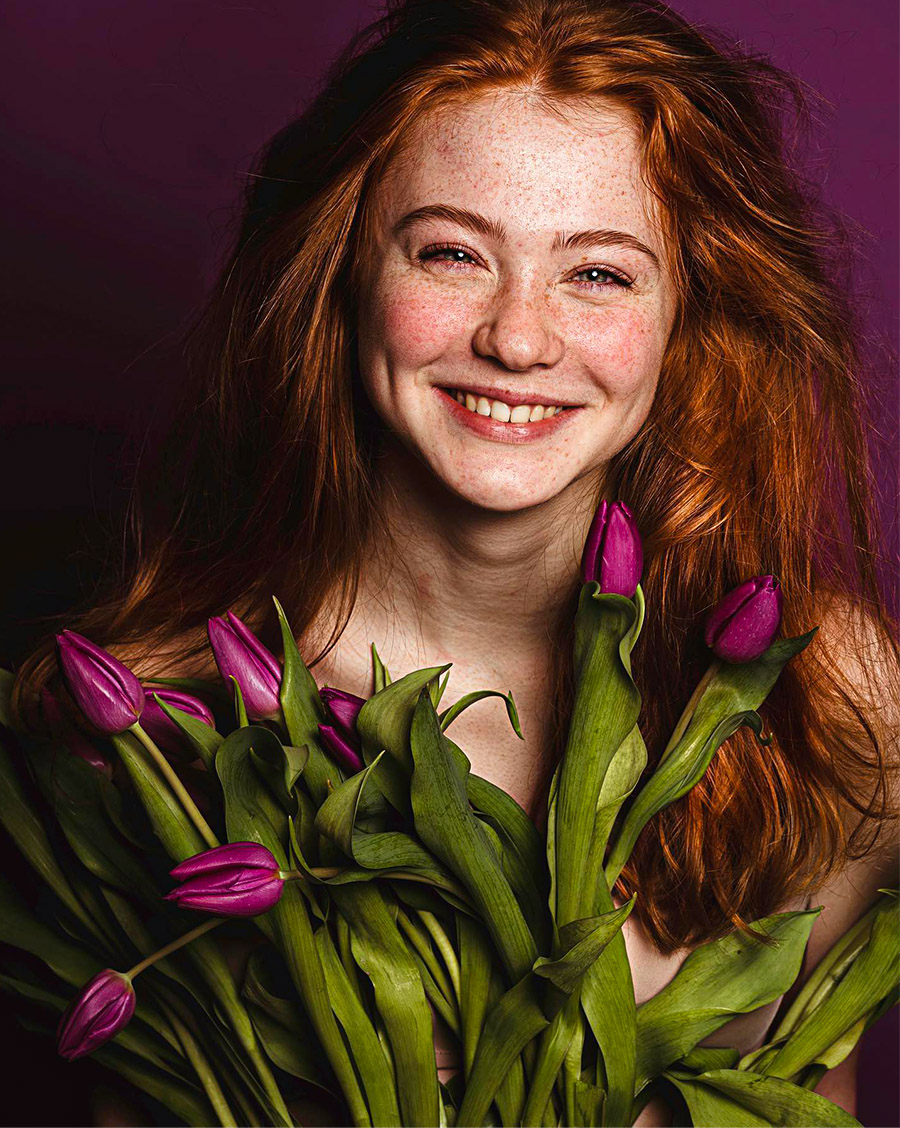 Red hair model with purple tulips