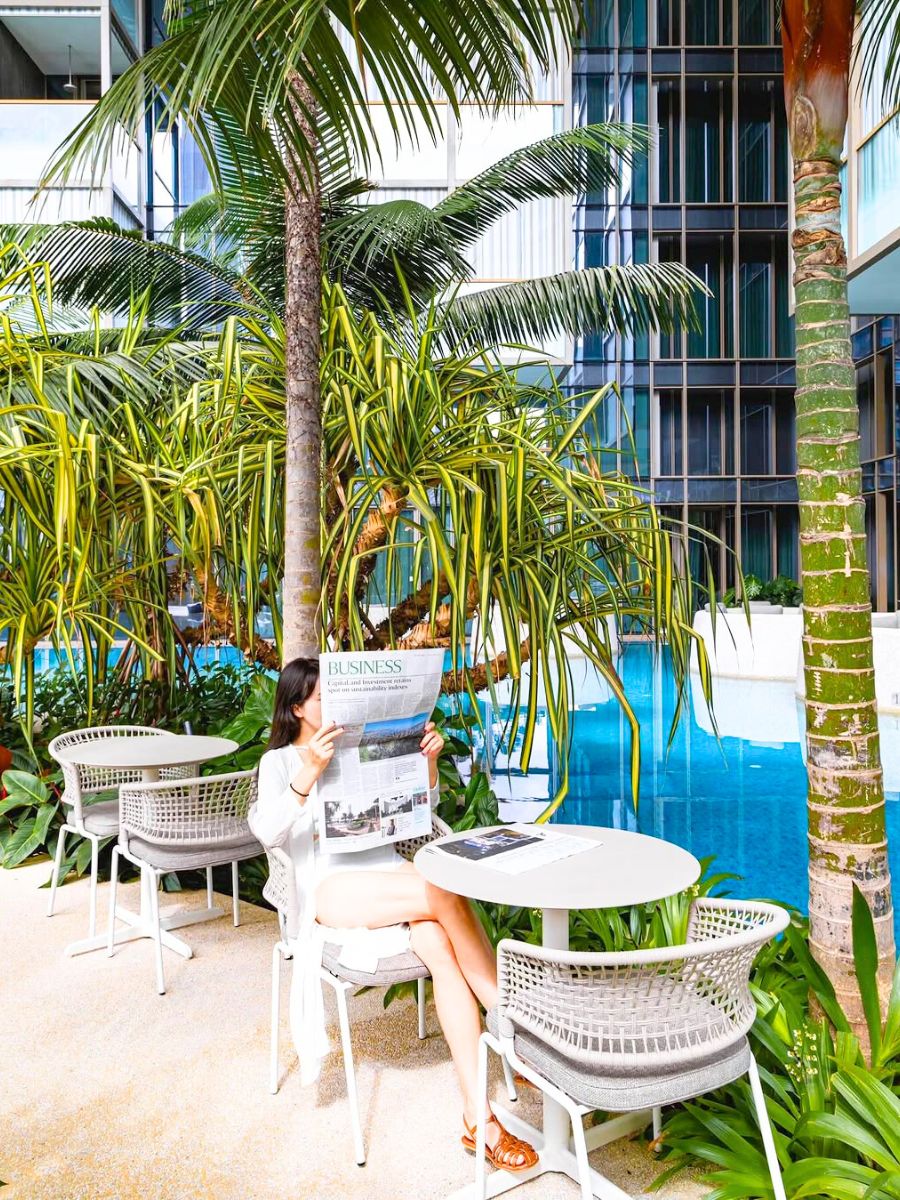 Girl reading newspaper at the Orchard hotel