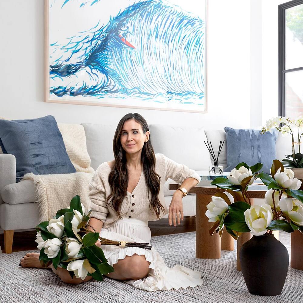 lady with white flower arrangement