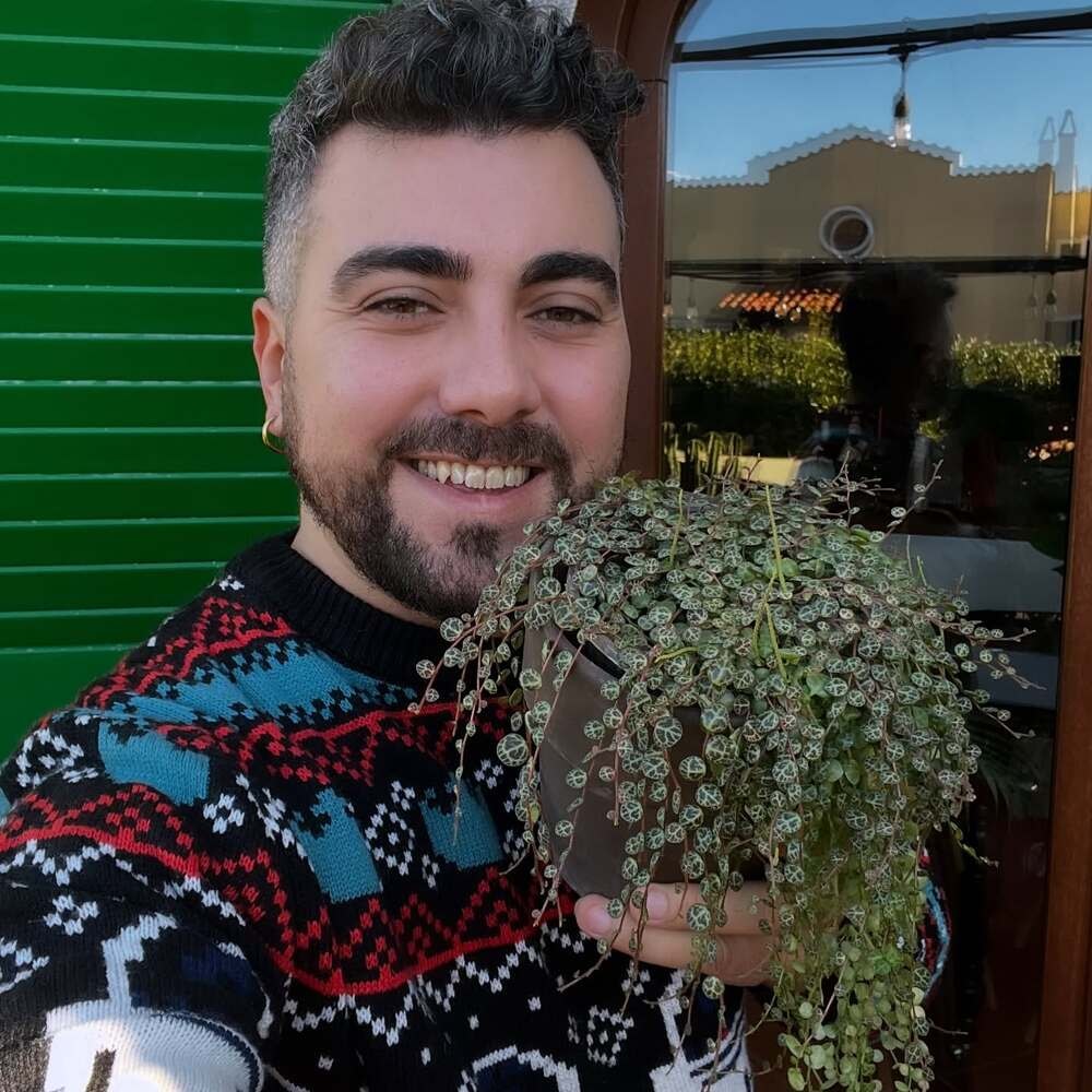 man displaying his beautiful string of turtles