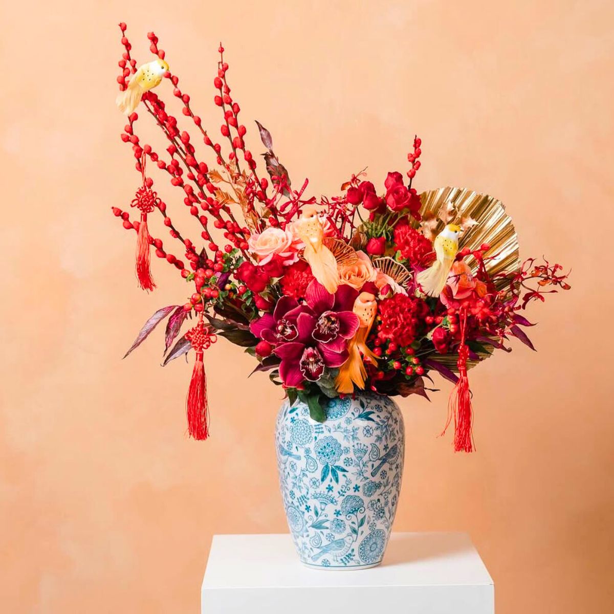 Red cymbidium orchids in Chinese New Year arrangement