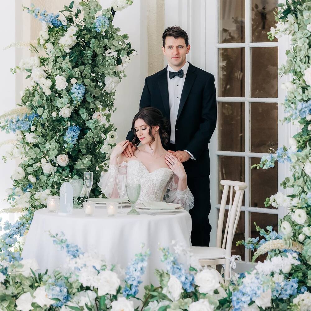 Couple standing near flower decoration