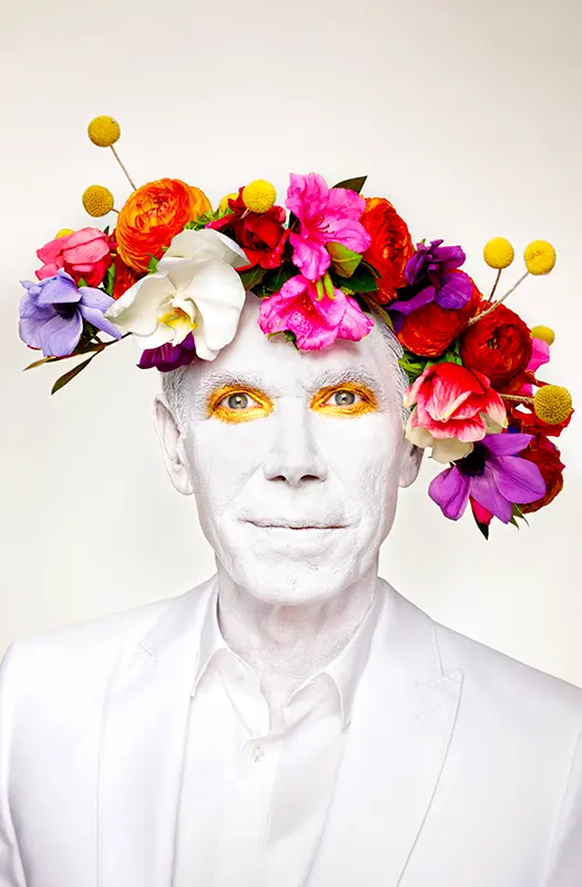 Flowers blooming from mans head portrait feature.webp