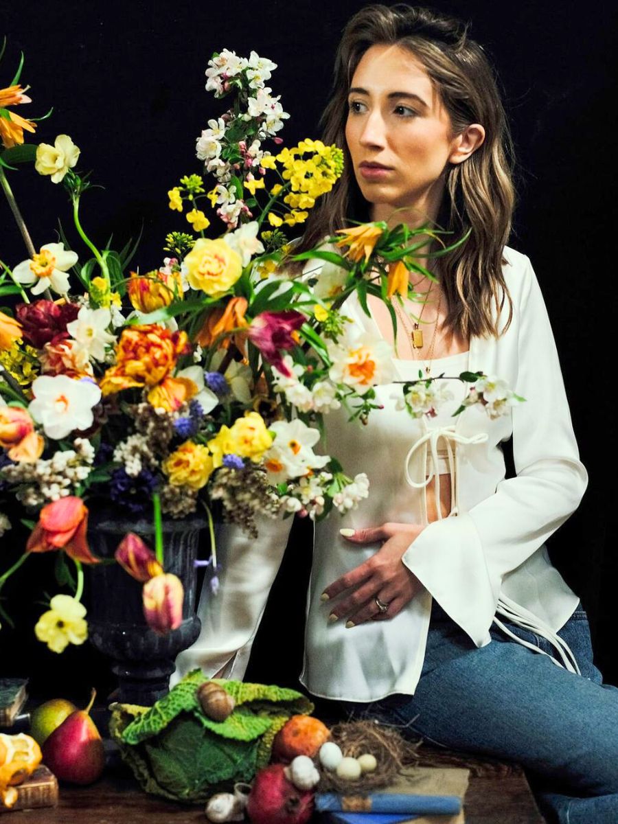 Maria Kristina Fenech with flower arrangement