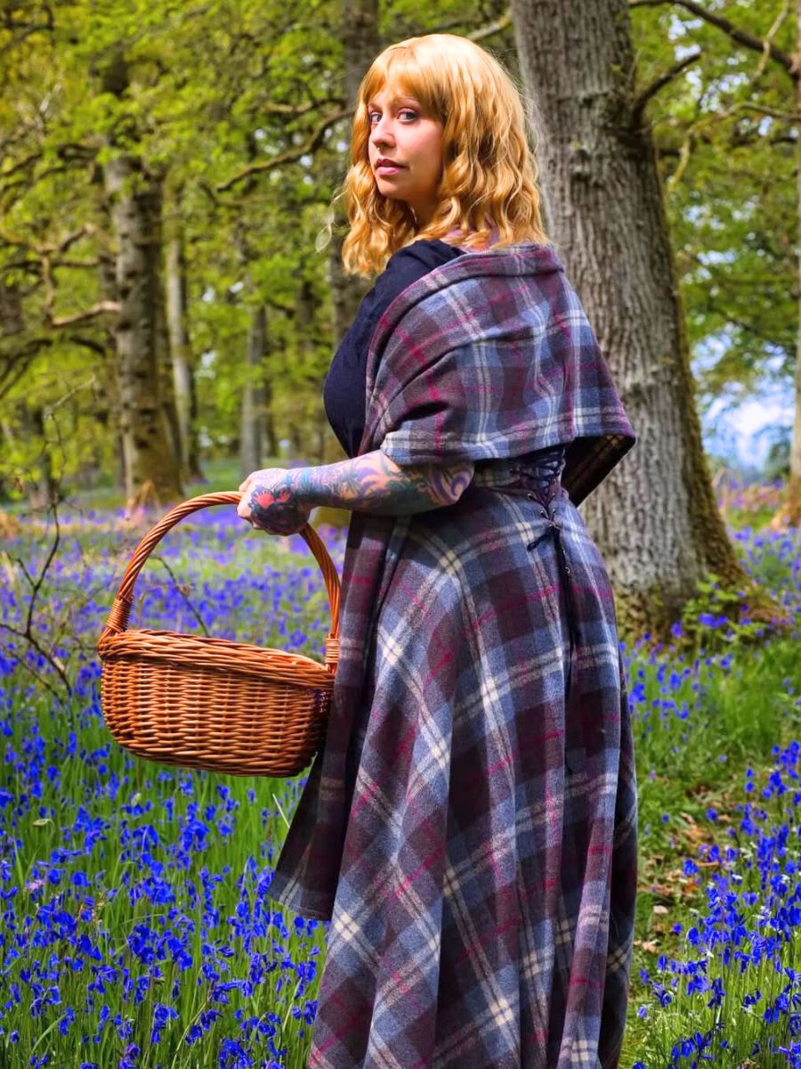 Woman in a field of bluebell flowers