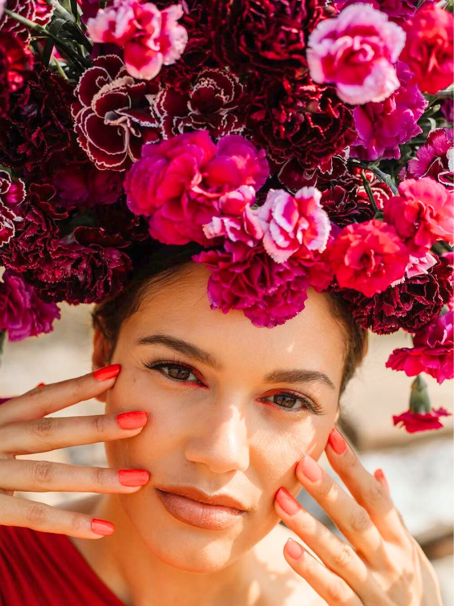 Carnations adorning a womans head