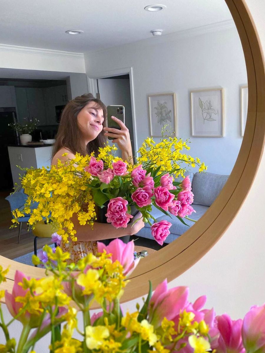 Emily with colorful flowers