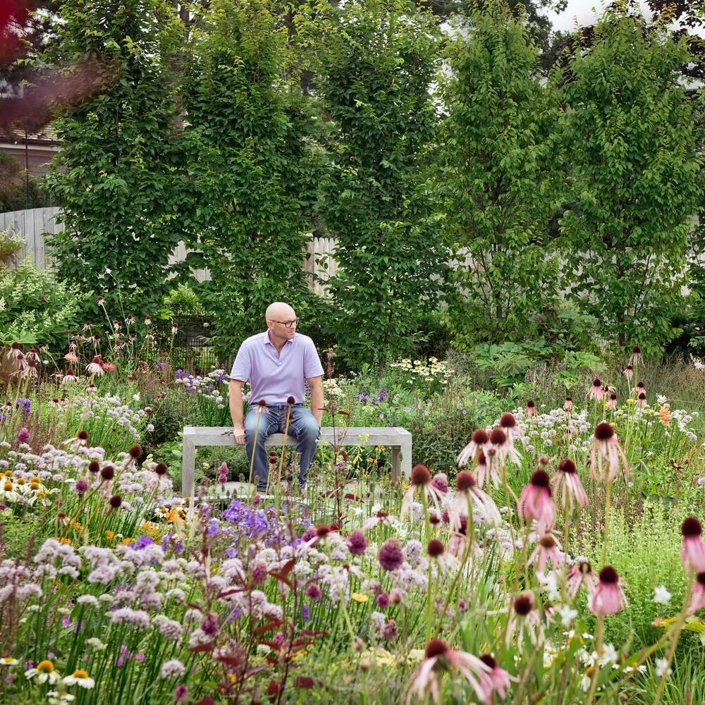 Men seating near to garden