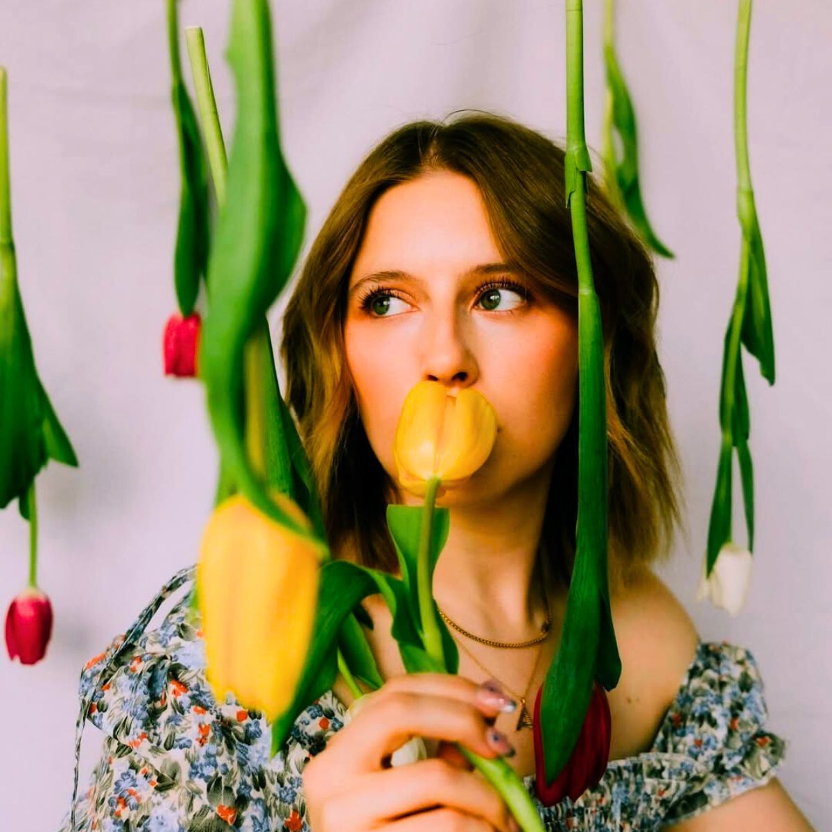 Girl smelling tulips