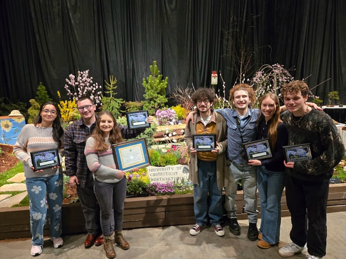 Club Student showcasing plant and flowers