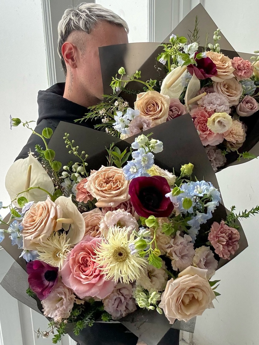 man holding Floral bouquet