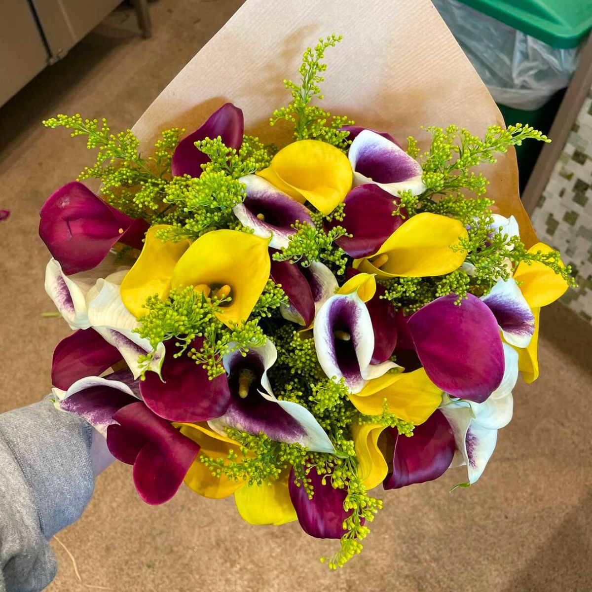 A mix of purple bicolor and yellow callas A mix of purple bicolor and yellow callas