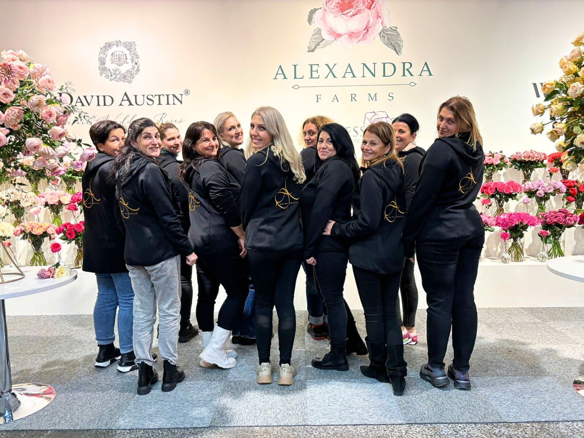 Alina Neacsa and her students takes a picture at Alexandra booth during the IFTF 2024 Flori cu Fitze Academy