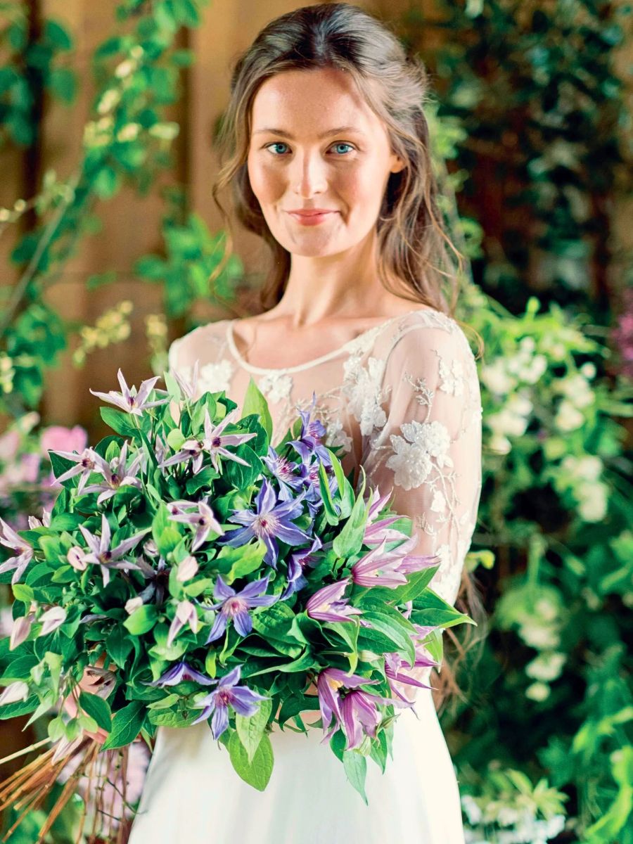 Clematis bouquet a woman holding a clematis bouquet - photo by marginpar