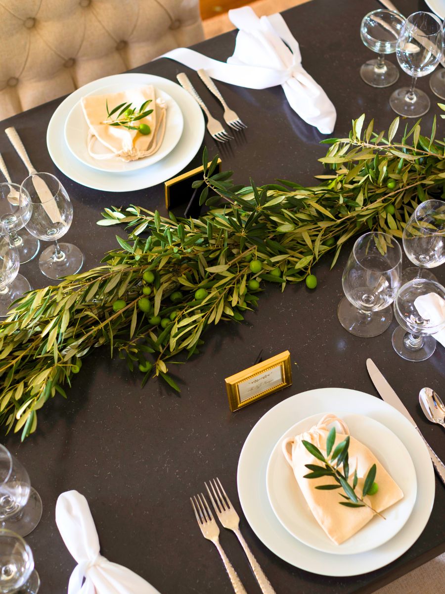 Table decor with olive garlands Table decor with olive garlands