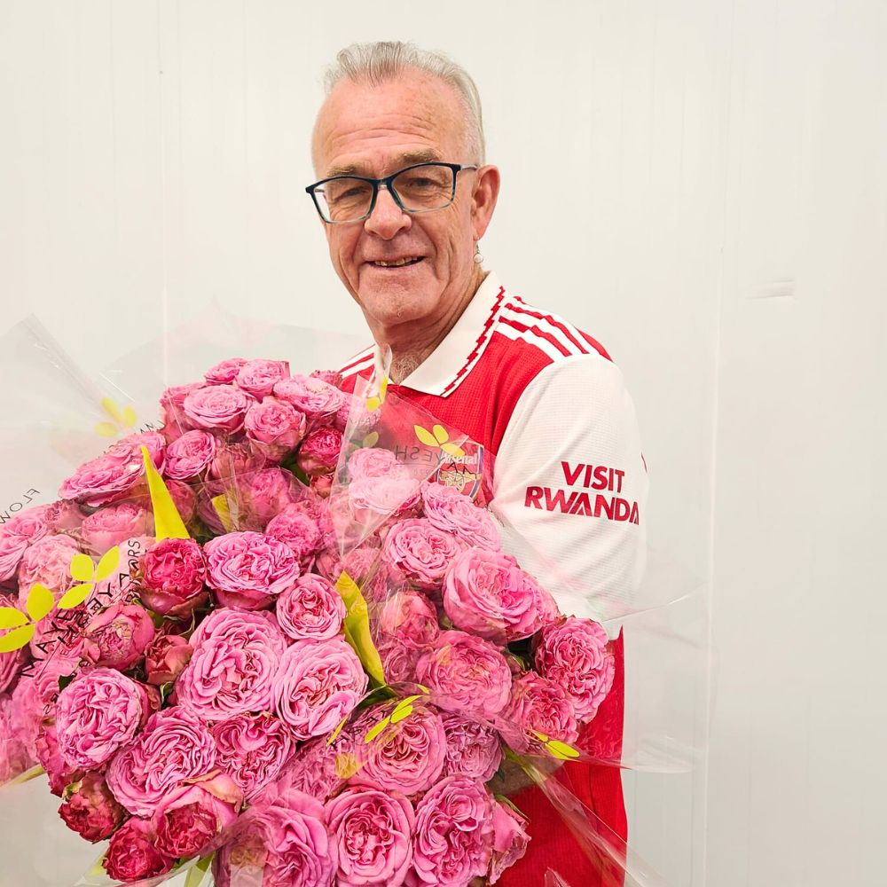 David Dahlson holds a bunch of roses rocking an Arsenal Jersey 10 Questions to David Dahlson