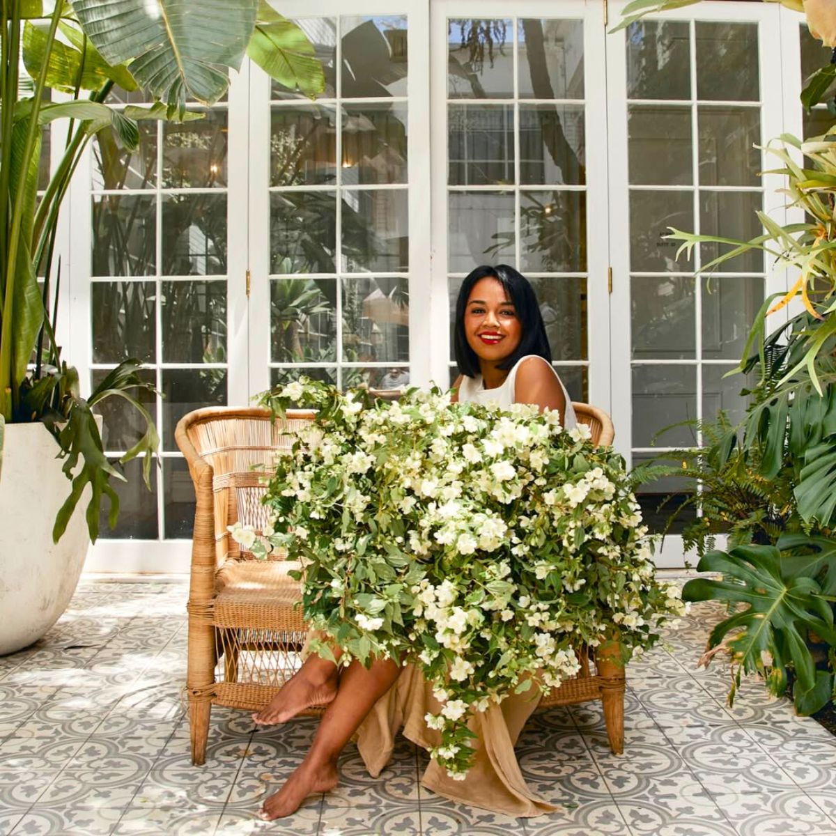Kowsh Rawson among green plants and flowers Kowsh Rawson among green plants and flowers
