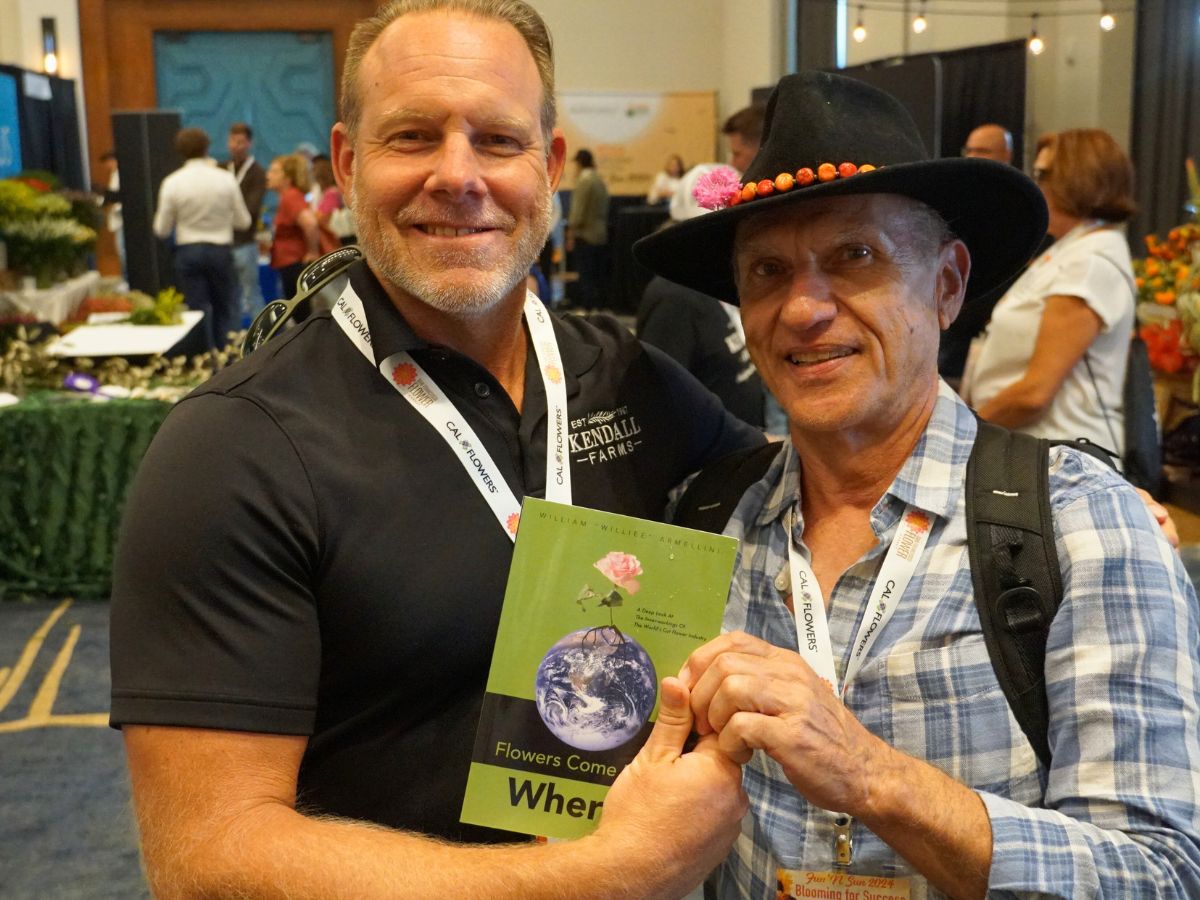 Willie Armellini handing his book to Jason Kendall of Kendall Farms California 10 Questions to William Armellini