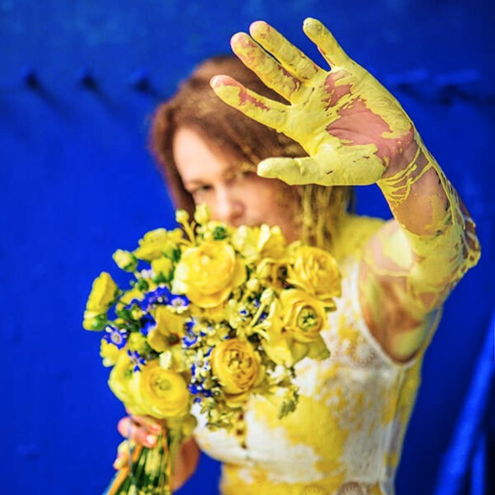 A model showcases an artistic creation of Driuchan Olena World Cup Floral Art 2025