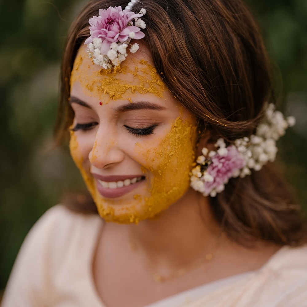 lady Celebrating haldi with flower jewelry lady Celebrating haldi with flower jewelry