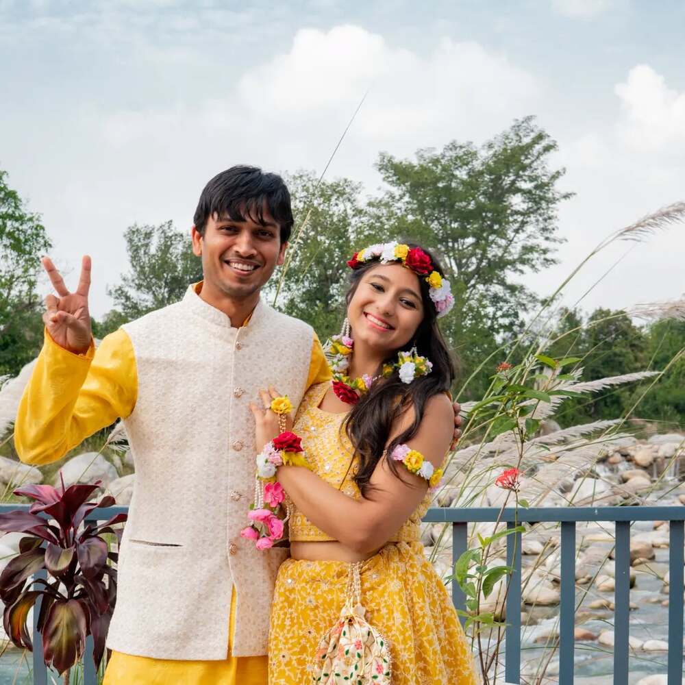 couple haldi with flowers couple haldi with flowers