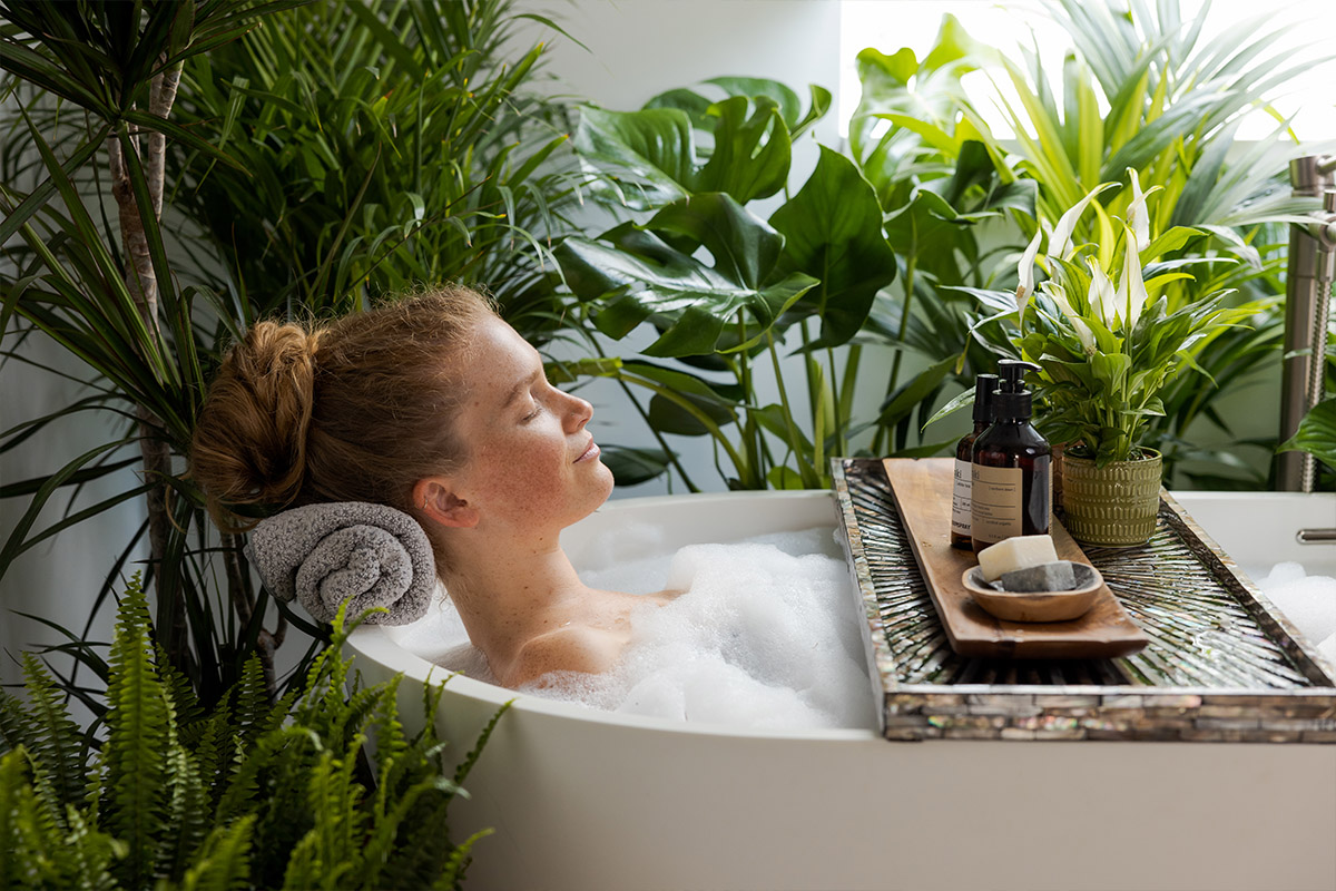 Air So Pure plants with model in wellness bath Air So Pure plants with model in wellness bath