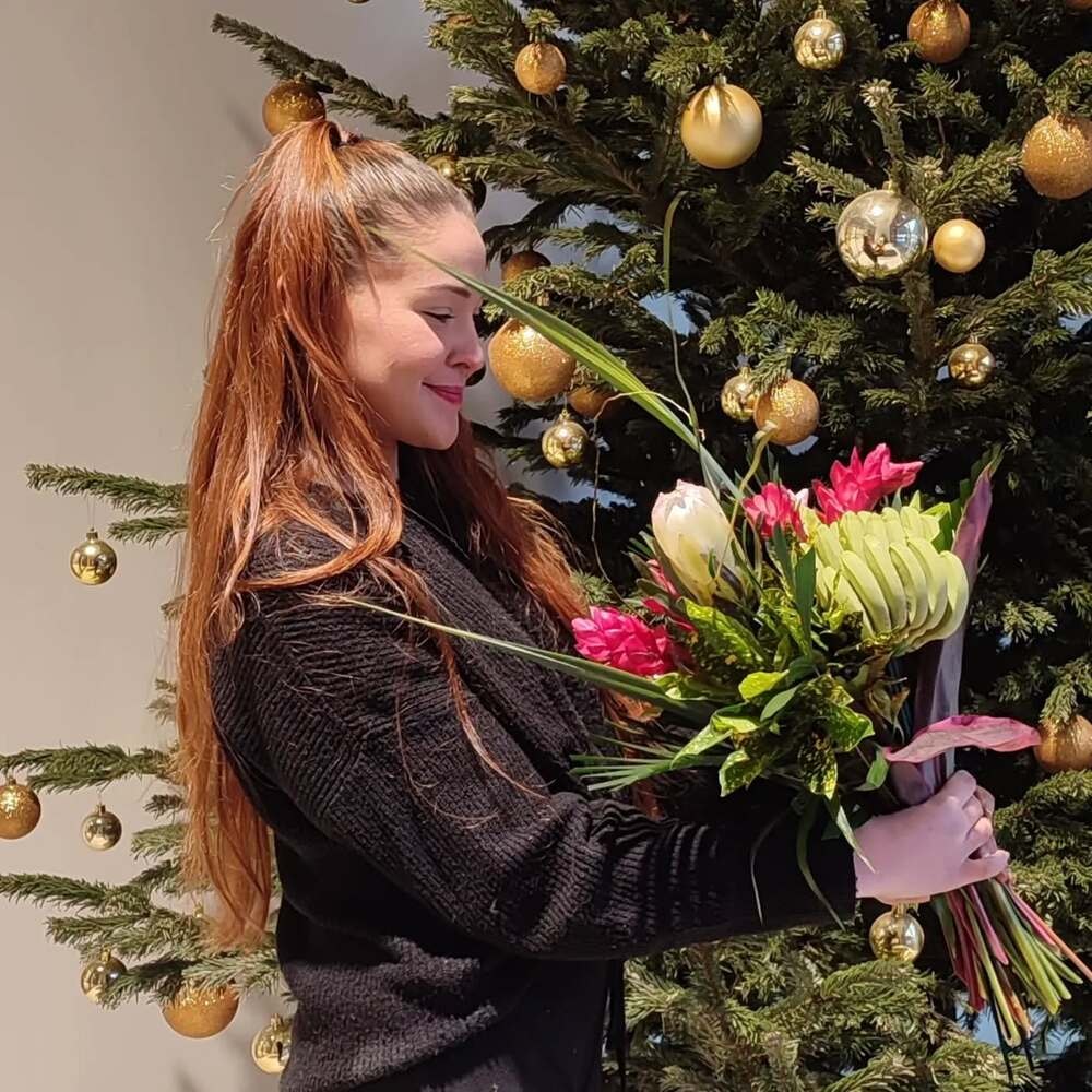 a woman possibly a florist designing her bouquet a woman possibly a florist designing her bouquet
