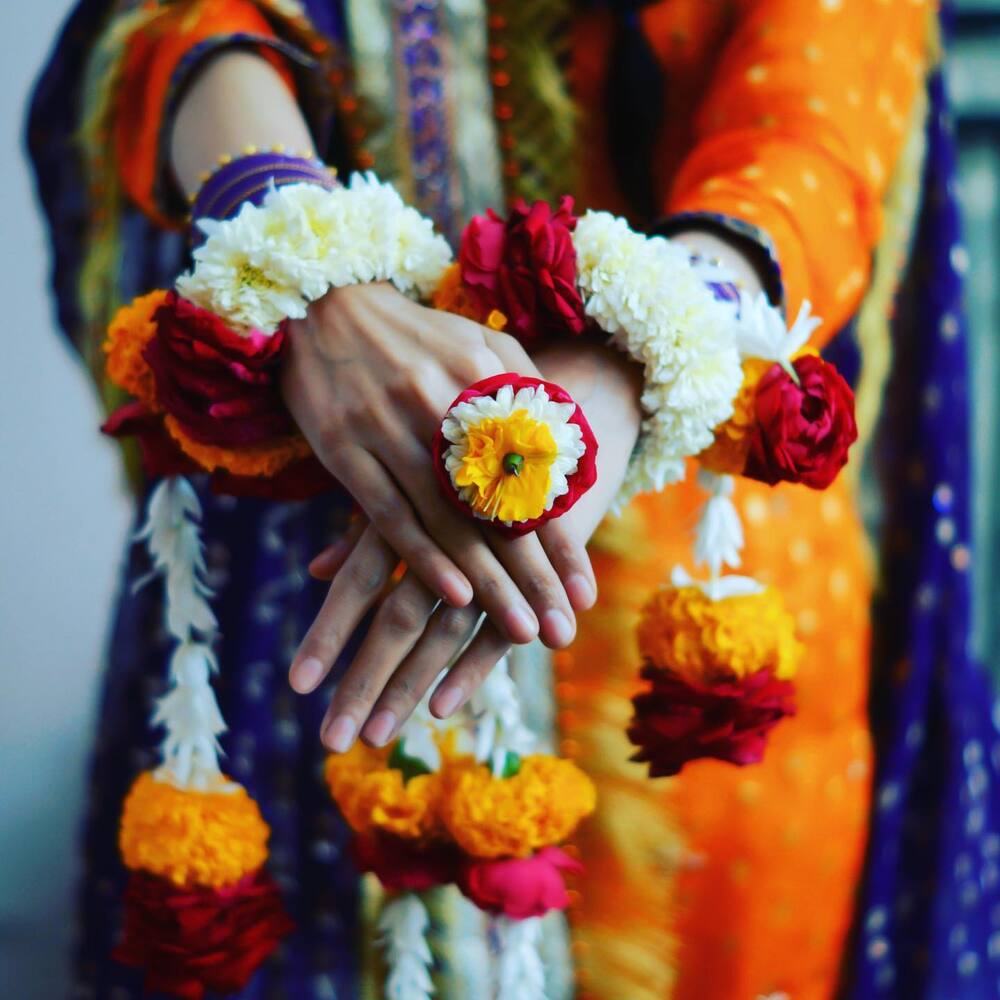 lady wear hand flower jewelry