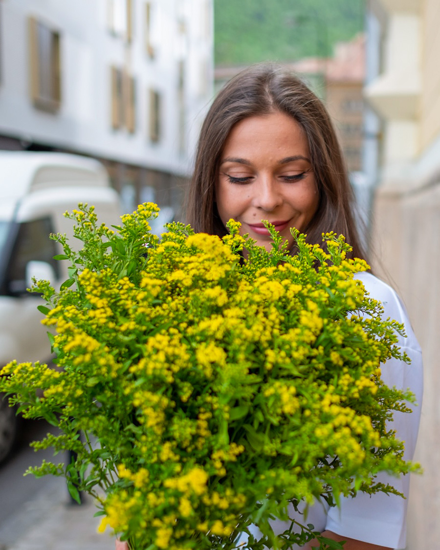 Girl with bunch of Solidago by fullbloom_fineartfloraldesign