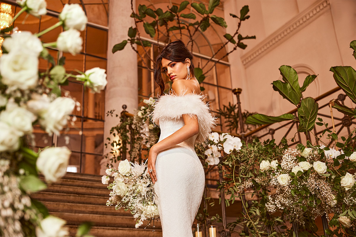 Bride in white with Rose Mont Royal on bridal stairs Bride in white with Rose Mont Royal on bridal stairs