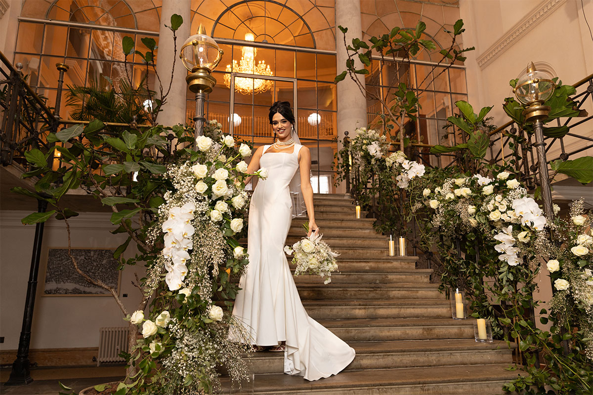 Smiling Bride with Rose Mont Royal on bridal stairs Smiling Bride with Rose Mont Royal on bridal stairs