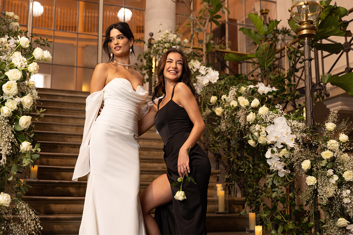 Women in white and black with Jacqui O wedding design
