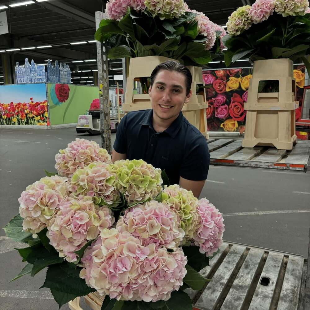 Men holding multi color flower