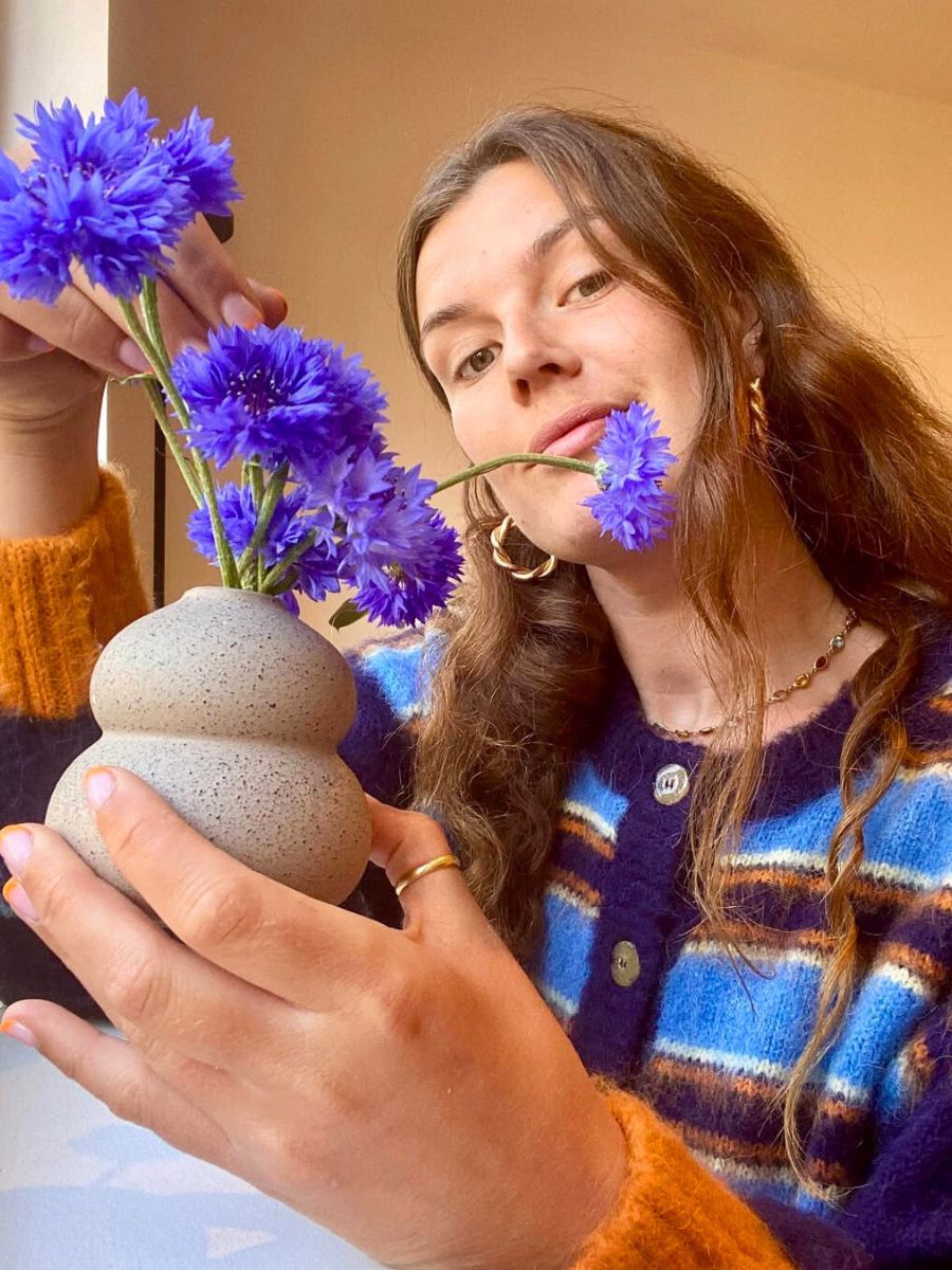 Flavia with purple flowers