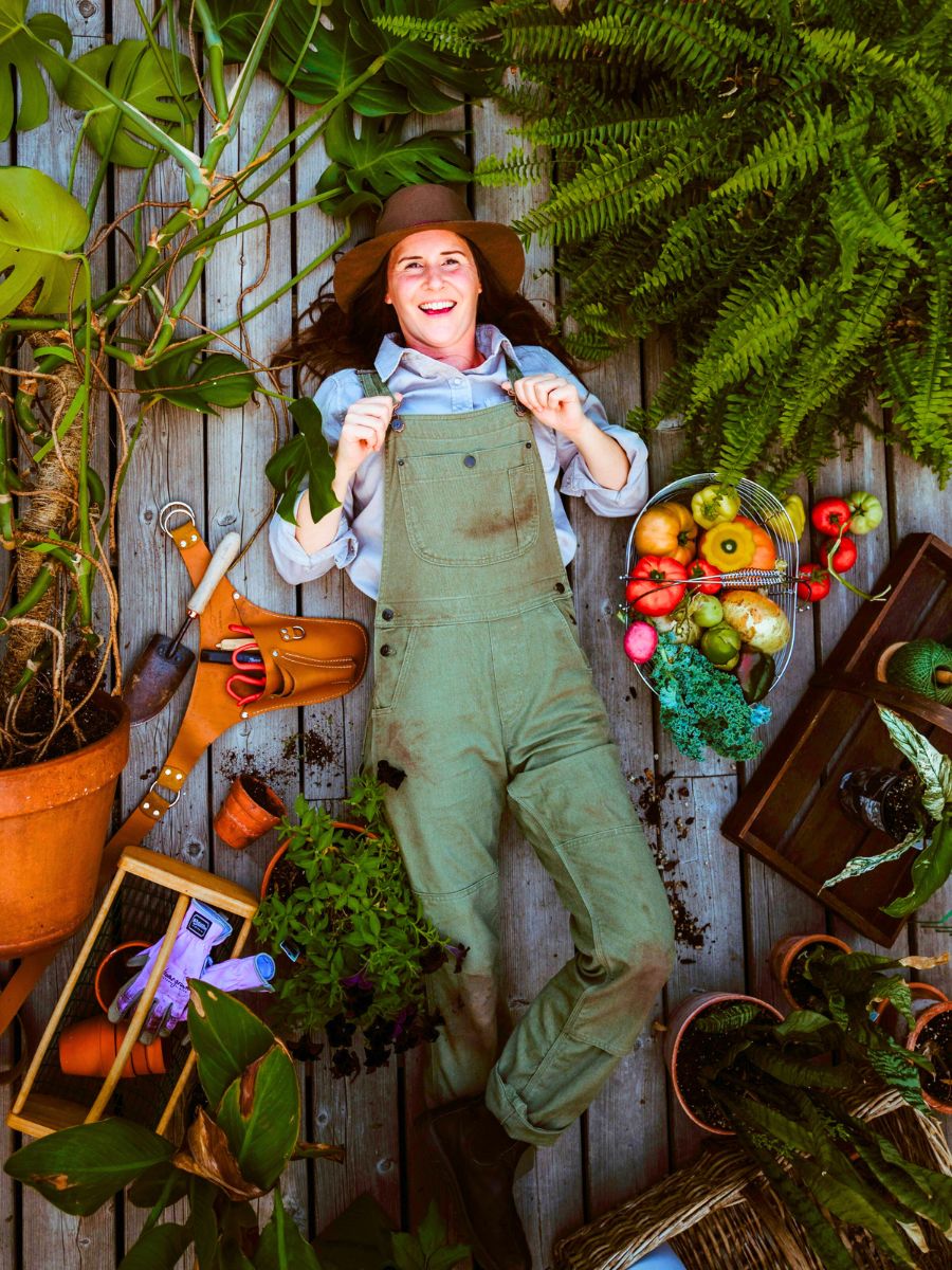 A woman happy with all her gardening stuff A woman happy with all her gardening stuff