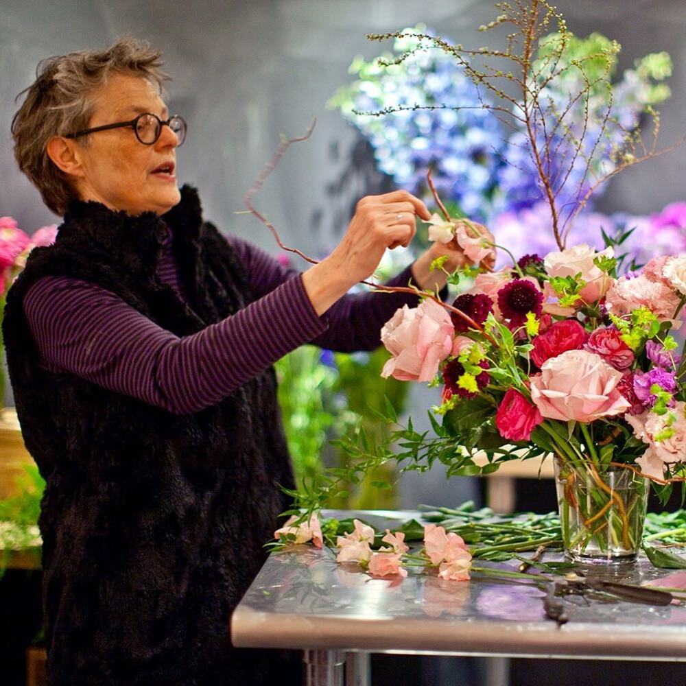 experienced lady teaching to new florist experienced lady teaching to new florist