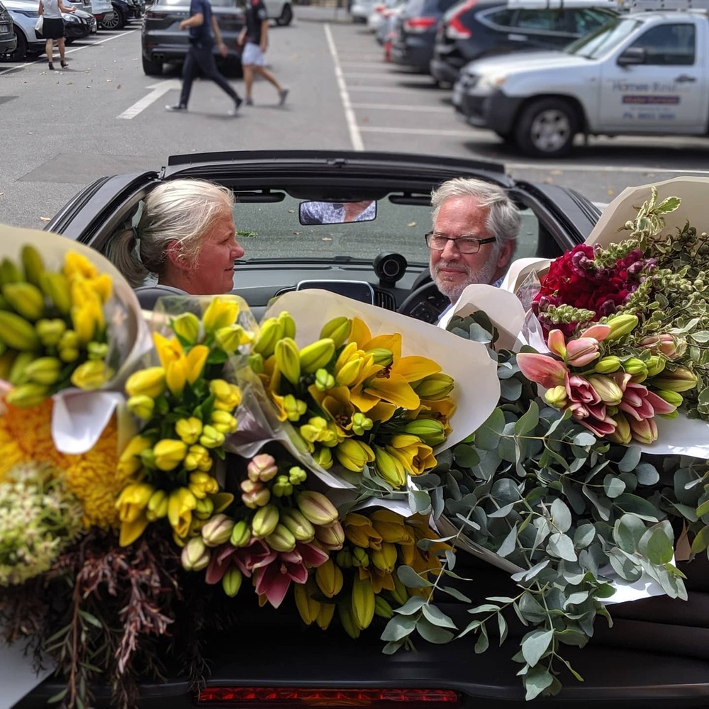 Old lady delivering flower in their city