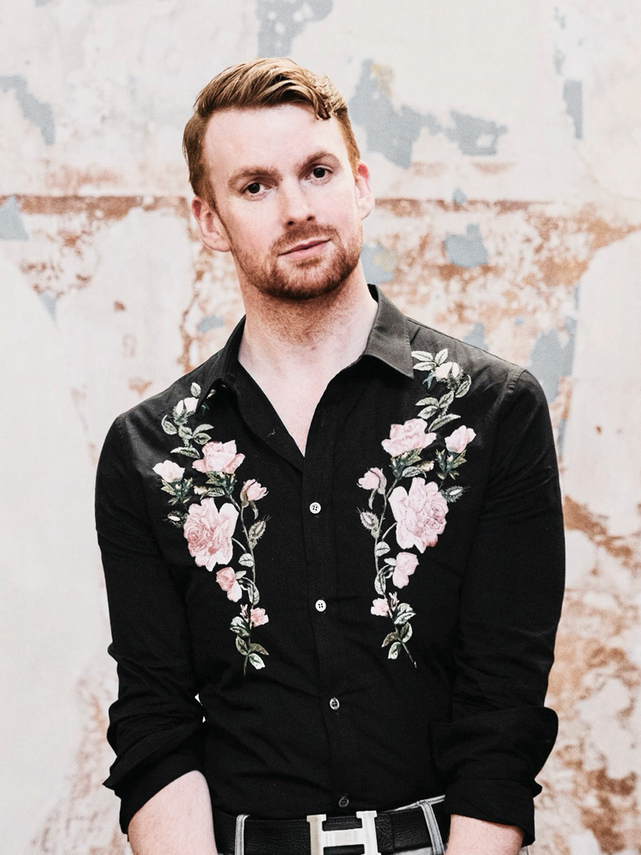 Joseph Massie posing with black floral shirt Joseph Massie posing with black floral shirt