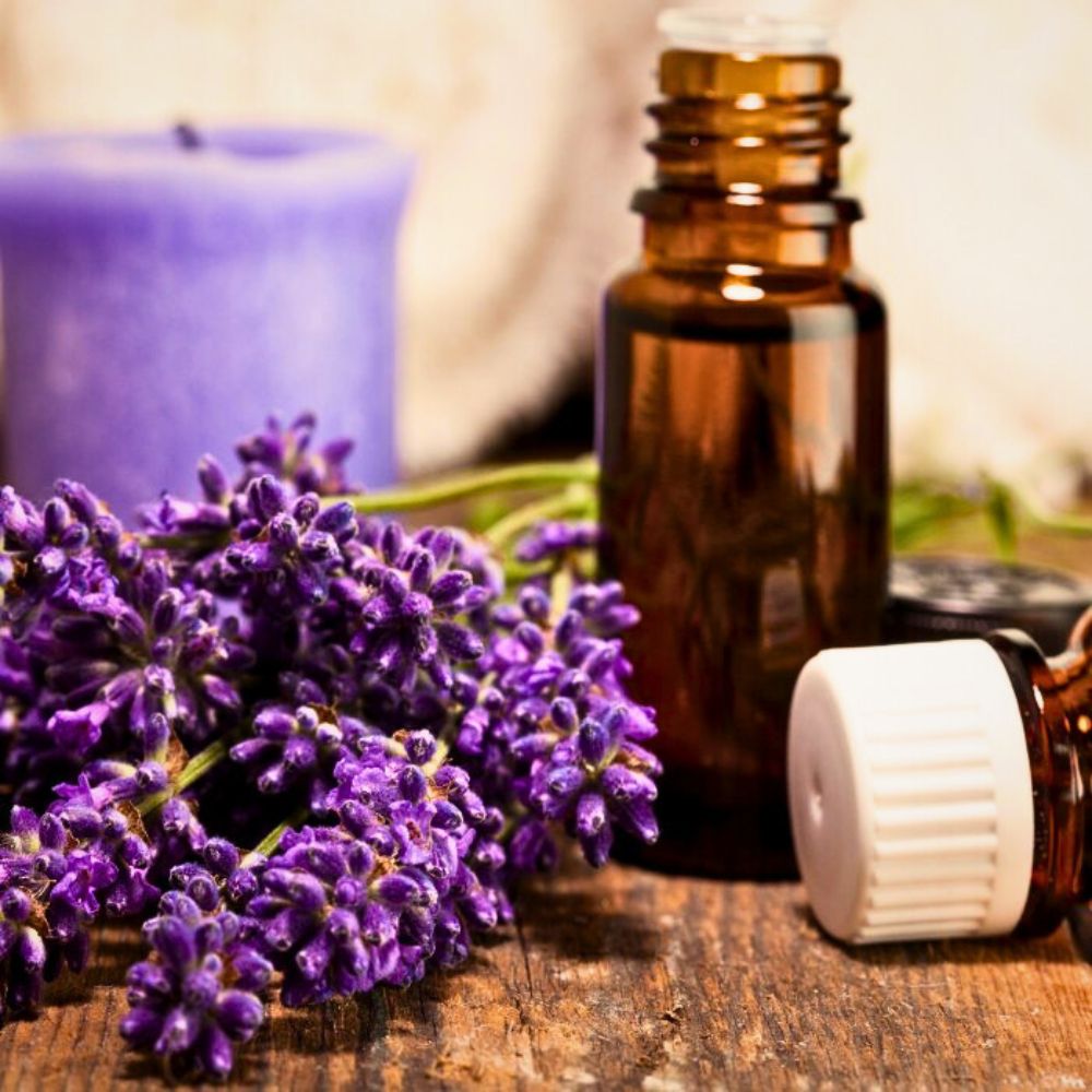 Lavender oil lavender oil - a container of essential oils with lavender kept at the side