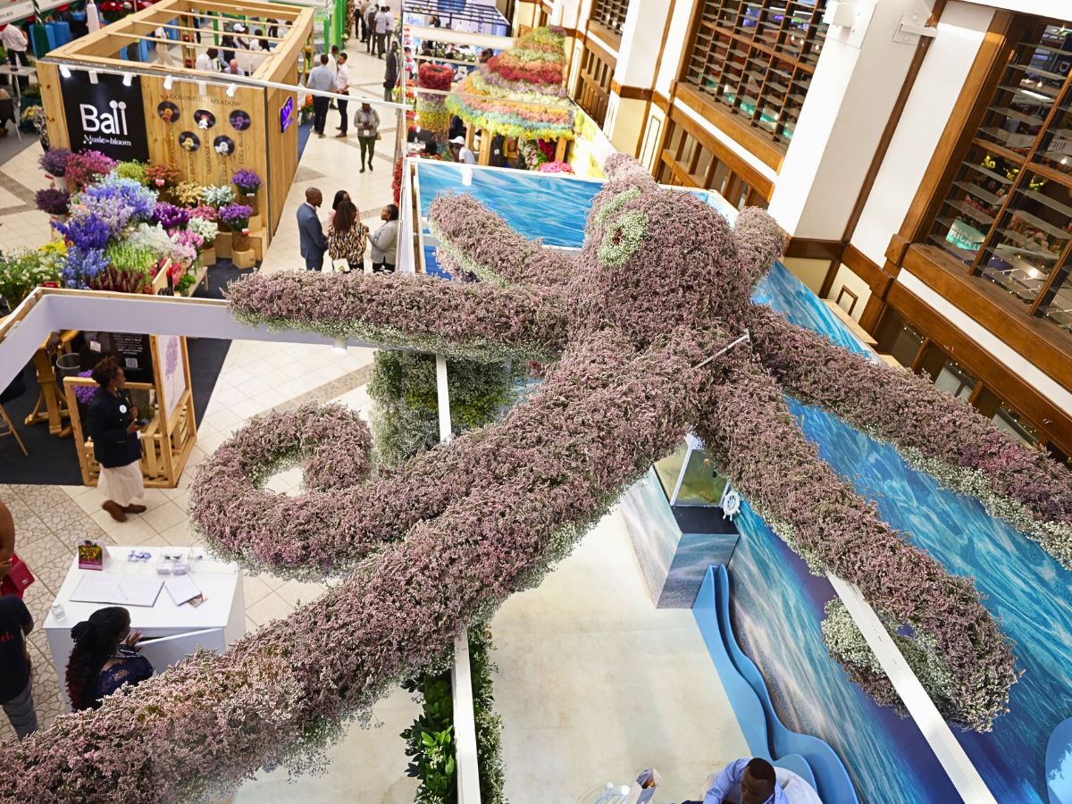 Floral installation at the top of Imani Flowers booth at the IFTEX Imani Flowers
